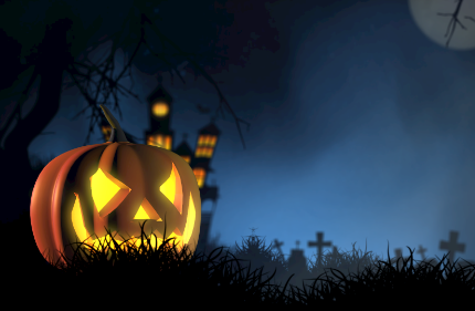 jackolanterns with haunted house and cemetery