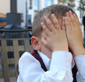 boy with head in hands