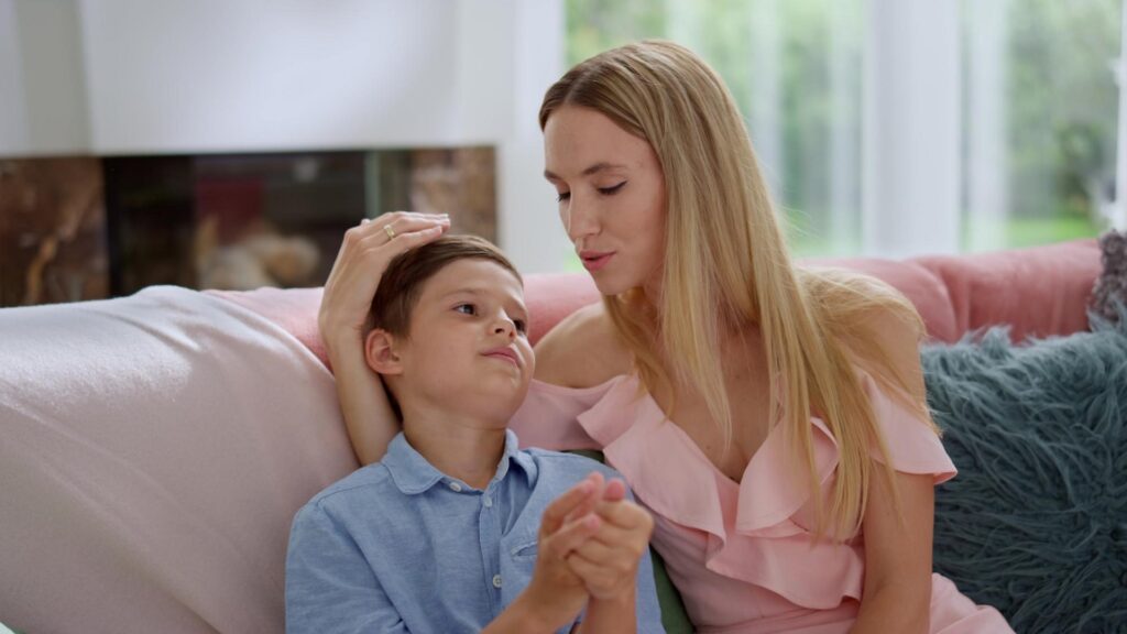 A young child with a primary caregiver, showing signs of anxious-preoccupied attachment style